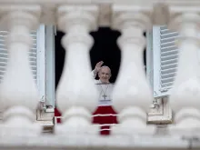 Pope Francis waves to people in St. Peter's Square during his Regina caeli address May 2, 2021.